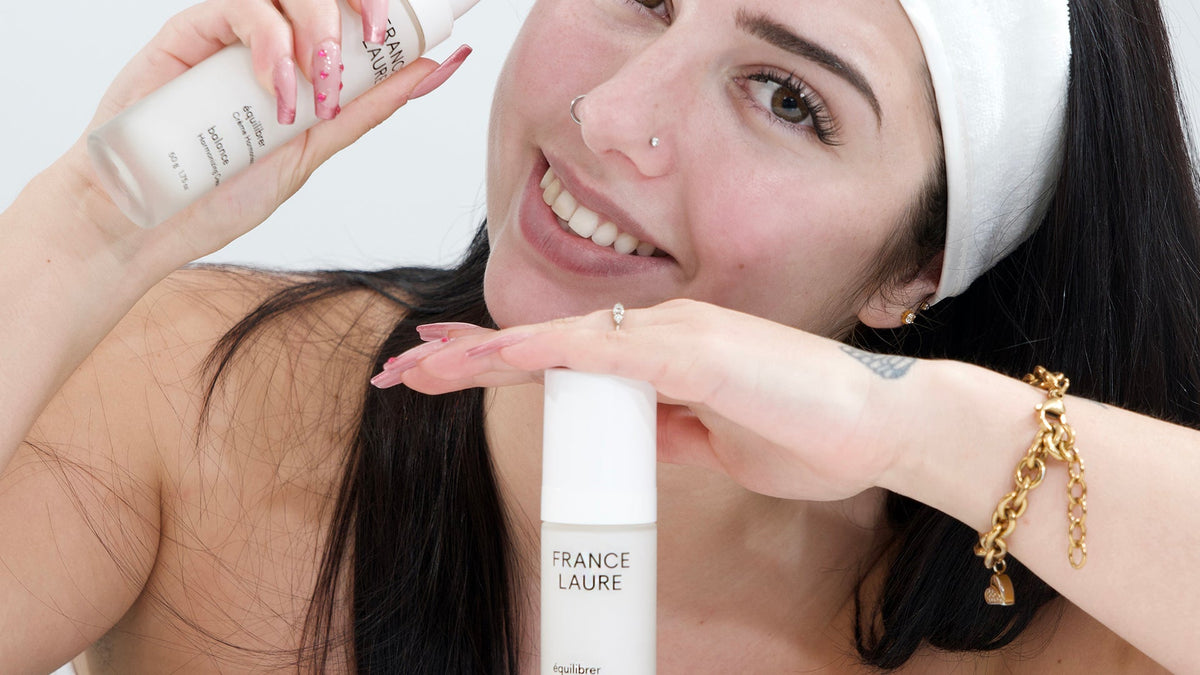 Woman holding the France Laure Balance Intense Serum and Balance Harmonizing Cream for combination skin