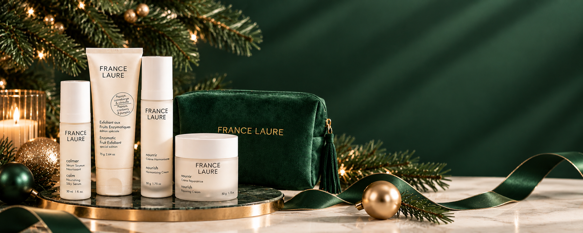 Four product for skincare, one green velvet pouch and a christmas tree for holiday gift sets