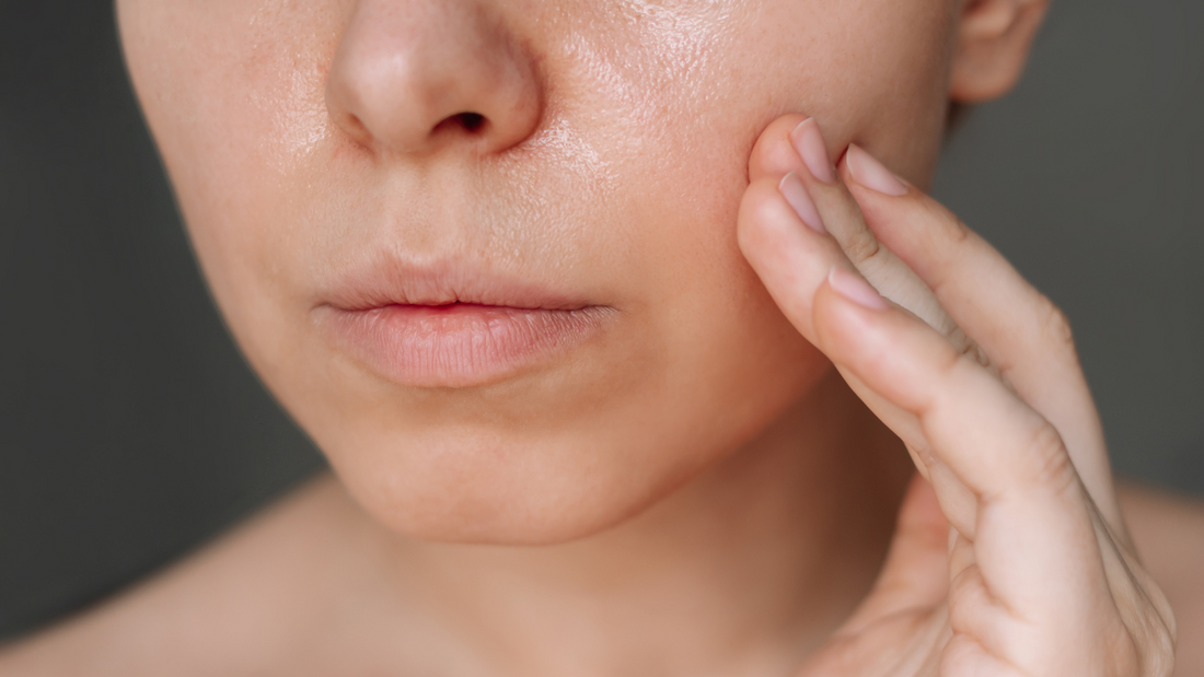 Close-up of radiant skin with gentle touch, showcasing hydration and smooth texture for all skin types and ages