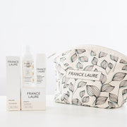 France Laure skincare set with nourish cream, cleansing mousse, environmental protection spray, and floral-print travel pouch