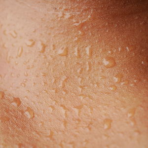 Close-up of hydrated skin with dewy texture, showcasing moisturizing skincare product effect for all skin types