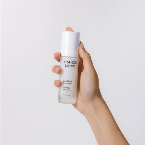 France Laure Balancing Serum bottle held in hand for oily skin hydration